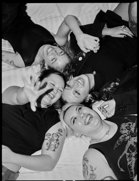 Teen Jesus and the Jean Teasers on a bed in a monochrome picture