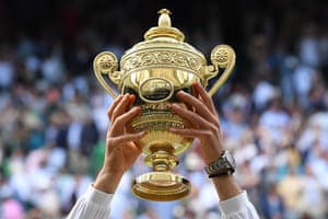 Novak Djokovic raises the winnerâs trophy.