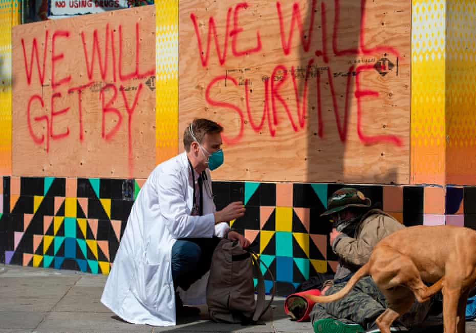 Stuart Malcolm, a doctor with the Haight Ashbury Free Clinic, speaks with homeless people about the virus in March.