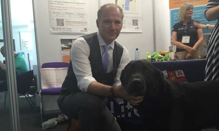 Adrian Treharne with guide dog Smudge.