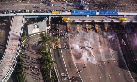 People are detained by police near the university in Hung Hom district on Monday