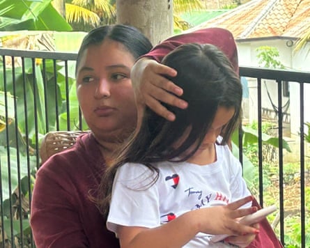 Génesis sitting on her mother’s lap