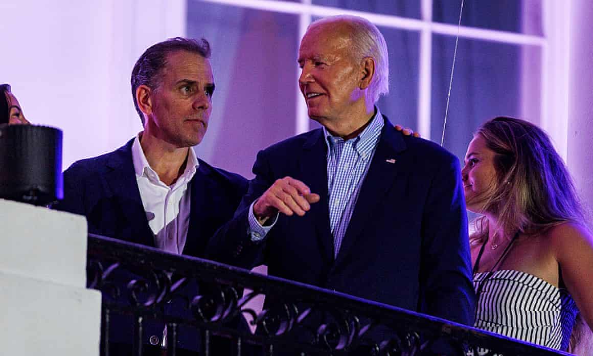 Hunter Biden and Joe Biden chat on the White House balcony, lit up at night