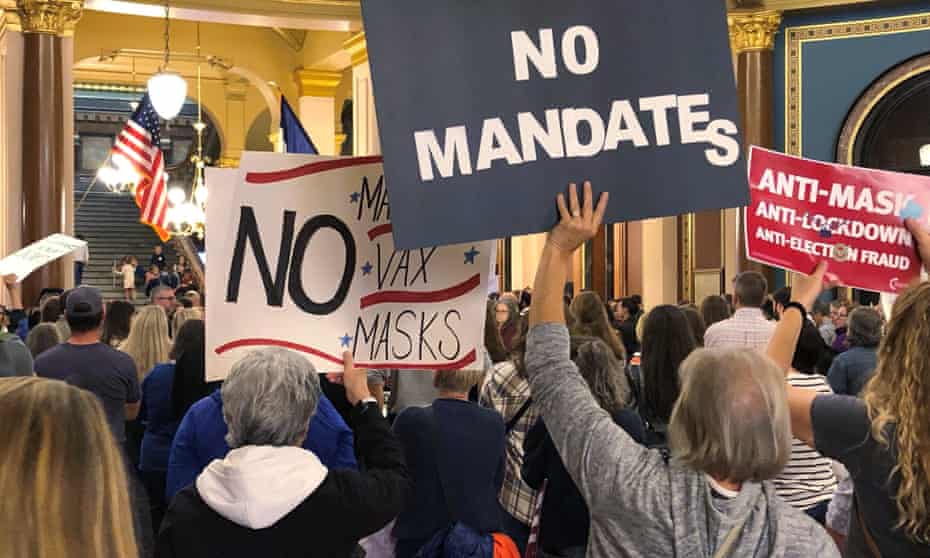 Protesters at the Iowa capitol in Des Moines push the legislature to pass a bill that would prohibit vaccine mandates from being imposed on workers.