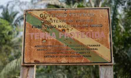 A bullet-riddled sign warning outsiders off the Uru-Eu-Wau-Wau reserve