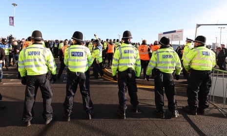 Police officers separate Coventry and Leicester fans before the match at the Coventry Building Society Arena.