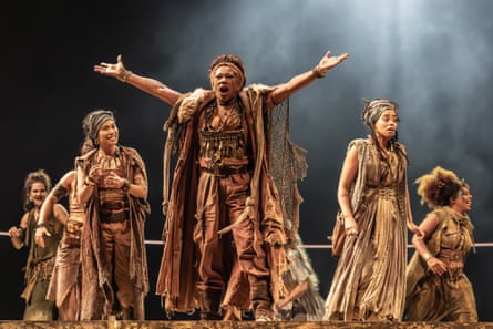 A barbarian-like band … Clare Perkins (Vida) and the company of Bacchae at the National Theatre.