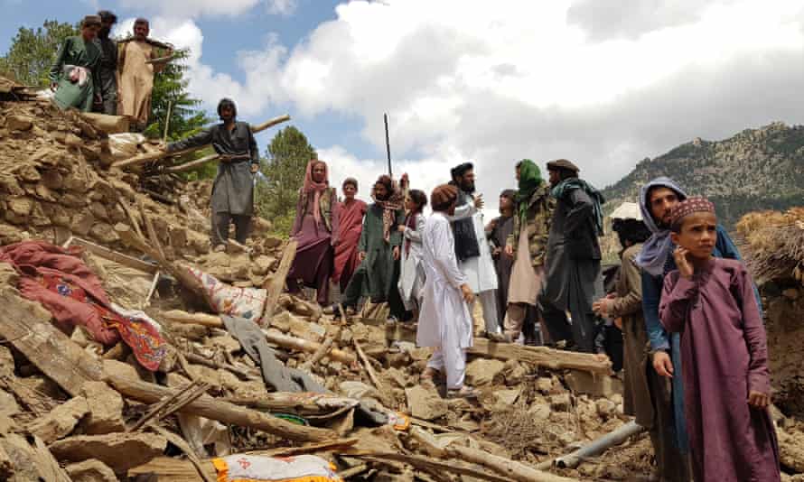 People search through rubble to find survivors of the earthquake in the Spera district of Khost province, Afghanistan