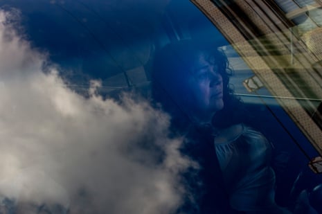 A woman in clar, a cloud reflected in the window