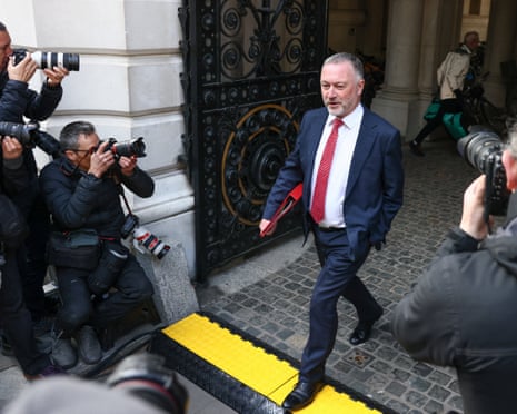 Steve Reed passes waiting photographers on his way to Downing Street