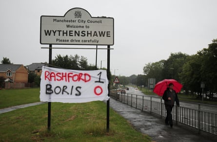 A banner is seen in Wythenshawe after the government agreed to extend free school meals during the summer holidays for struggling families in England, bowing to pressure from Marcus Rashford