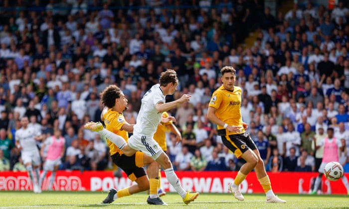 Leeds United Brenden Aaronson and Wolves’ Rayan Ait-Nouri go for the ball and it ends up in the net.