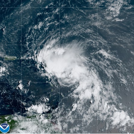 This satellite image released by NOAA shows Tropical Storm Laura in the North Atlantic on Friday.