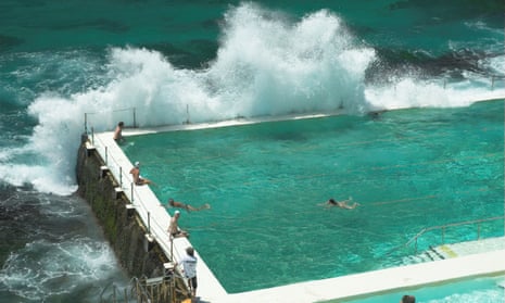 A wave breaks over the Bondi Icebergs pool in Sydney