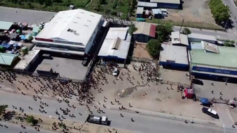 Drone video shows scale of looting in Papua New Guinea – video