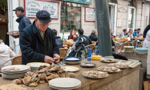 Man opening oysters on street, Vigo