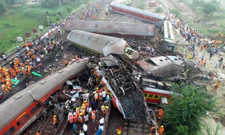 Wrecked carriages are strewn across the tracks after the crash