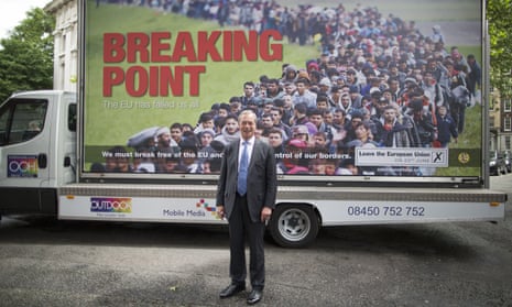 Nigel Farage stands in front of 'Breaking Point' poster