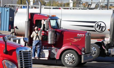Truckers wait with their truck, at the Marathon Oil Refinery to be loaded with fuel in Salt Lake City, Utah, 