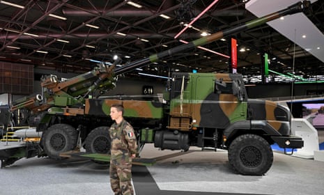 A French soldier stands in front of ‘CAESAR’ self-propelled 155 mm/52-calibre gun-howitzer at the Eurosatory international land and airland defence and security trade fair, in Villepinte, a northern suburb of Paris, on June 13, 2022.