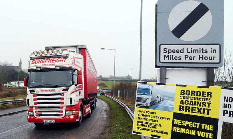 A lorry passes an anti-Brexit placard at the Ireland-Northern Ireland border crossing in Killeen