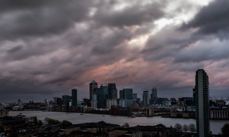 Skyline of London and the Thames, with dramatic clouds of Storm Barney and its 40mph winds