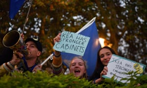 Anti-Brexit protesters shout slogans with placards and EU flags near parliament