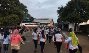 Staff arrive for worth at the PT Buma factory in Subang, Indonesia, which makes Ivanka Trump branded clothing.