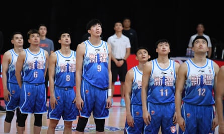 Xinjiang Flying Tigers line up before a match against Jilin Northeast Tigers at the 2020-2021 season of the Chinese Basketball Association (CBA) league in Zhuji, Zhejiang Province, on 15 January 2021.