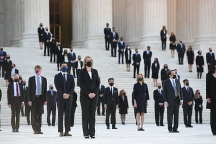 People wait for Ginsburg’s casket to arrive at the supreme court on Wednesday.