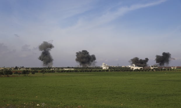 Columns of smoke rise after airstrikes hit the town of Saraqeb in Idlib province, Syria, on Thursday.