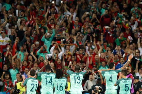 Portugal players celebrate with their fans after the game.