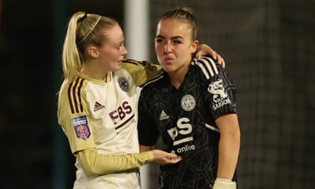A dejected Kirstie Levell is consoled by a Leicester teammate.