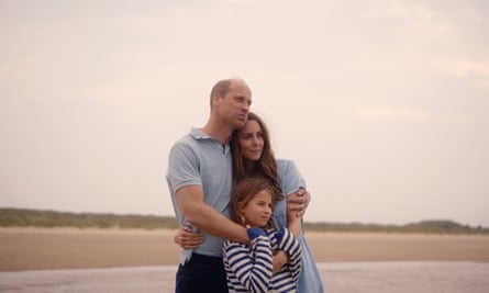 William, Kate and Charlotte hug on a beach