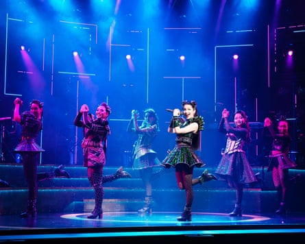 The cast of Six dancing on stage.