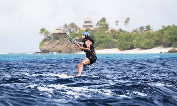 Barack Obama kitesurfs during his stay on Moskito Island, in the British Virgin Islands.
