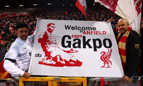 Liverpool fans hold up a banner welcoming Cody Gakpo to the club
