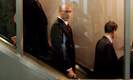 Vladimir Putin uses an escalator between meetings at the world summit of the UN in New York in 2005. His plan to attend for the first time in a decade this September has added spice.