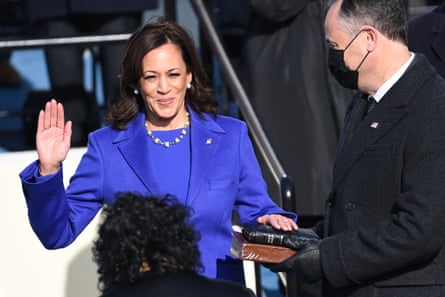 Kamala Harris, flanked by her husband and the second gentleman, Doug Emhoff, is sworn in as vice-president.