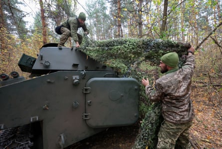 Ukrainian servicemen operate near frontline in the Kharkiv area.