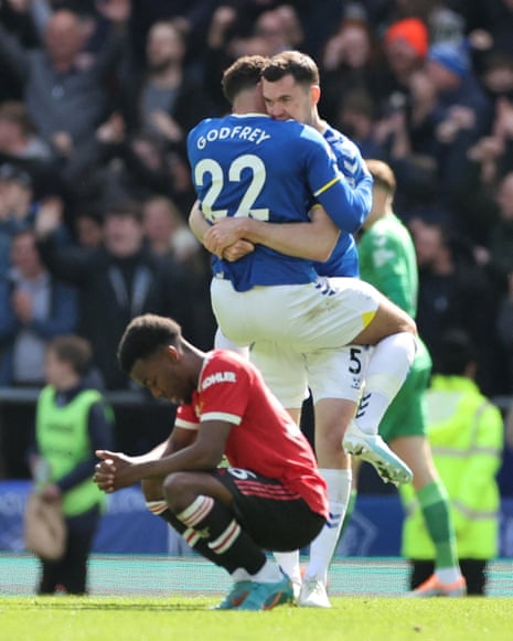 Everton’s Michael Keane celebrates with Ben Godfrey as Manchester United’s Anthony Elanga looks dejected.