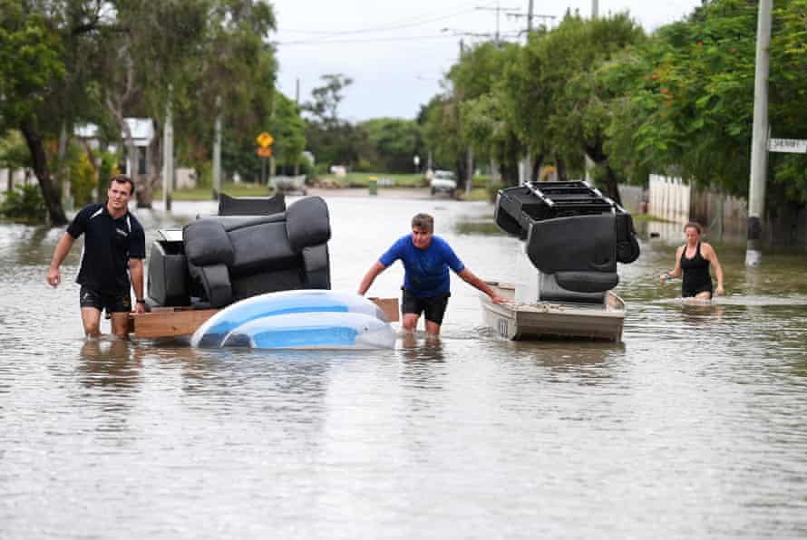 Residents of Hermit Park cleaning up after floods in 2019.