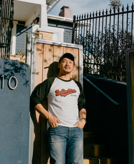 Nathan Tiep stands in front of his house in Boyle Heights. After initially acquiring a gun, he decided to take lessons to feel more comfortable about gun safety in his home.