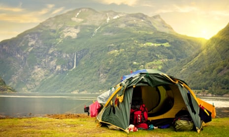 Tent by lake and mountain in Norway