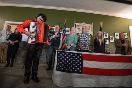 Cory Pesaturo plays the national anthem on accordion to start voting after midnight on the day of the US presidential primary election in Dixville Notch, New Hampshire.