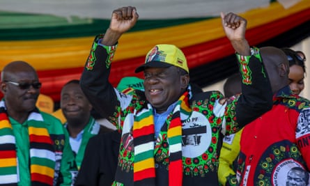 Zimbabwean president Emmerson Mnangagwa greets supporters before the explosion at an election rally in Bulawayo