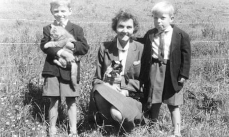 Allan Jenkins (on the right), aged four, with his mum and her Siamese cat, and his brother Christopher, aged five.