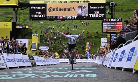 Tadej Pogacar takes a bow as he crosses the line to clinch victory on stage six of the Tour de France