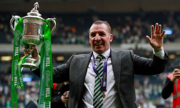 Brendan Rodgers celebrating with the Scottish Cup after victory against Aberdeen