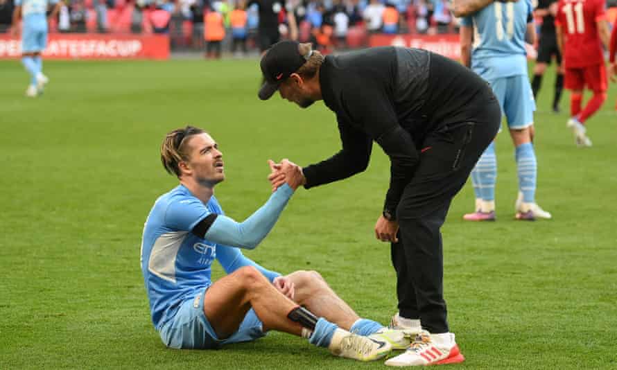 Jürgen Klopp consoles Jack Grealish after Liverpool’s 3-2 win over Manchester City in the FA Cup